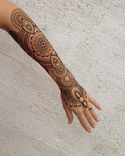 large arm henna tattoo